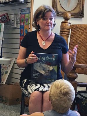 Michelle Cusolito
Children’s author and Rochester resident Michelle Cusolito read from her latest release “Flying Deep” on July 23 at Rochester’s Plumb Library. Photo by Marilou Newell
