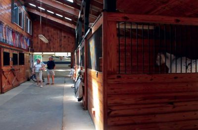 RLT Tour
Sterling Pointe Farm in Rochester boards and trains horses of several varieties including painters and saddlebreds.  This was the first year the farm participated in the Rochester Land Trust Barn, Home, and Garden Tour.  Photo by Eric Tripoli
