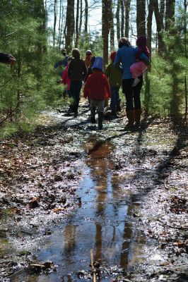 Buzzards Bay Coalition
One of the educational events the Buzzards Bay Coalition had planned for April vacation brought kids to the 6.1-acre property to explore the marshy beach for a scavenger hunt. The osprey from a nearby nest kept a close eye on the group until the treasures were tallied and the group waded back down the mud-puddled path to the road. Photo by Jean Perry
