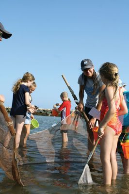 Seining the Shore
The Buzzards Bay Coalition hosted a “Seining the Shore” activity with a couple dozen kids at Silvershell beach on Friday, July 22. The kids practiced tossing the seine net to capture small sea creatures and explore what was caught. Photos by Jean Perry
