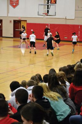  Students Teacher Basketball
 Students and teachers did about as much playing around as they did playing basketball during the students versus teachers co-ed basketball game at Old Rochester Regional High the evening of March 7. The teams were neck and neck throughout the evening – students in white and teachers in black – and neither team seemed to have an advantage over the other at any point during the game. Photo by Jean Perry
