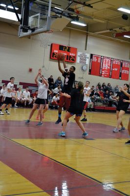  Students Teacher Basketball
 Students and teachers did about as much playing around as they did playing basketball during the students versus teachers co-ed basketball game at Old Rochester Regional High the evening of March 7. The teams were neck and neck throughout the evening – students in white and teachers in black – and neither team seemed to have an advantage over the other at any point during the game. Photo by Jean Perry
