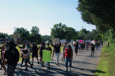 BLM Rochester
A “Black Lives Matter” protest march drew hundreds to Rochester late in the afternoon of June 12. Escorted by several Rochester policemen on foot, participants who had gathered in front of Town Hall marched down Dexter Lane to the police station, where several individuals spoke about racism and told stories of discrimination based on skin color. The protest was organized by Wareham resident Alexis Sylvia, who had spent several years living in Mattapoisett and Rochester. Photos by Mick Colageo
