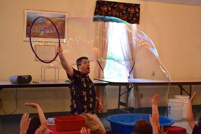 Mike the Bubble Man
Mike Dorval, aka Mike the Bubble Man, wowed Tri-Town children on June 23 with his exciting presentation on the science behind bubbles. The show kicked off the Plumb Library’s summer reading program, and the Rochester Cultural Council helped fund the event. Photos by Jean Perry
