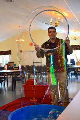 Mike the Bubble Man
Mike Dorval, aka Mike the Bubble Man, wowed Tri-Town children on June 23 with his exciting presentation on the science behind bubbles. The show kicked off the Plumb Library’s summer reading program, and the Rochester Cultural Council helped fund the event. Photos by Jean Perry
