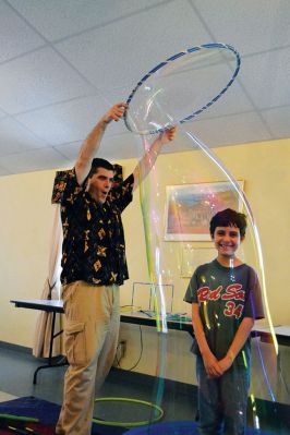 Mike the Bubble Man
Mike Dorval, aka Mike the Bubble Man, wowed Tri-Town children on June 23 with his exciting presentation on the science behind bubbles. The show kicked off the Plumb Library’s summer reading program, and the Rochester Cultural Council helped fund the event. Photos by Jean Perry
