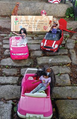 Barbies
Many neighbors and friends have been asking about the Barbies. Due to virus concerns, we made a conscious decision not to create the display this year since it draws so many visitors of all ages to congregate near our gate. Instead, the Barbies are observing social-distancing guidelines with masks on, as this photo taken on July 4 illustrates. We hope that the full crew will be out next year.
Photo by Teresa Dall - July 9, 2020 edition
