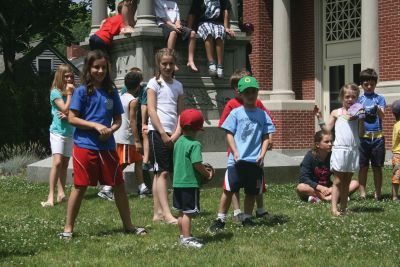 Gatemen at the Library
Fred Shepard preparing to catch a ball thrown by one of the children. Photo by Katy Fitzpatrick. 
