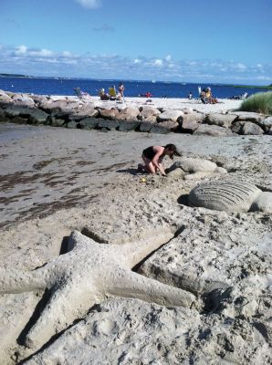 Viva la Summer!
Kelly Bruce entertained beachgoers at Silvershell Beach with her sand art on August 4, 2011. With the help of her dad, Tom Bruce, she created larger-than-life sea turtles and starfish. Viva la Summer! Photo courtesy of Susan Bruce. August 11, 2011 edition
