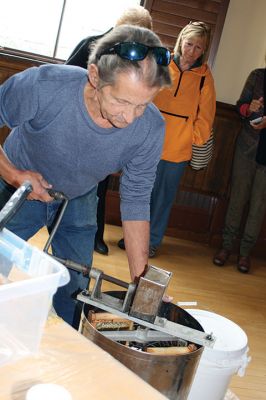 Bee Talk
Local cranberry grower and beekeeper Paul Rinta demonstrated honey extraction during a presentation on the plight of bees in North America given by his wife and business partner Linda Rinta, a local bee expert and educator. The event was a partnership between the Sippican Land Trust and Marion Garden Group and took place on September 30. Photos by Marilou Newell
