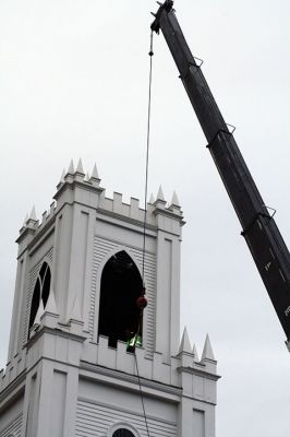 First Congregational Church of Rochester
The bell of the First Congregational Church of Rochester rang above the center of Rochester for the last time this morning, November 20, before it was lowered from the church’s belfry via crane to the ground, the final step of the renovation on the church. The historic bell, created in 1892 by an apprentice of Paul Revere III, grandson to our famous bell maker Paul Revere, will be refurbished and put in storage for some time before it is returned to the church. Photo by Jean Perry
