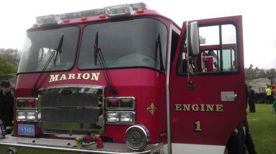 Big Trucks
Despite the soggy weather on Saturday, May 11th, close to 100 kids of all ages came to Marion Recreation’s Kid’s Equipment Day held at Town Field on Main Street. Kids were able to climb and explore a fire truck, ambulance, bucket truck, police cruiser, street sweeper and construction vehicles. All children received a free fire hat or construction hat. Many volunteers were on hand to assist the kids and to answer any questions. 
