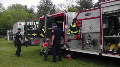 Big Trucks
Despite the soggy weather on Saturday, May 11th, close to 100 kids of all ages came to Marion Recreation’s Kid’s Equipment Day held at Town Field on Main Street. Kids were able to climb and explore a fire truck, ambulance, bucket truck, police cruiser, street sweeper and construction vehicles. All children received a free fire hat or construction hat. Many volunteers were on hand to assist the kids and to answer any questions. 
