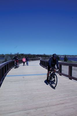 Mattapoisett Bike Path
A newly signed Memorandum of Understanding between the Town of Mattapoisett and the Commonwealth of Massachusetts has opened the Shining Tides section of the Mattapoisett Bike Path. On Monday, people and dogs could be seen along the attractive structure that connects Reservation Road to Goodspeed Island Road. Photos by Mick Colageo
