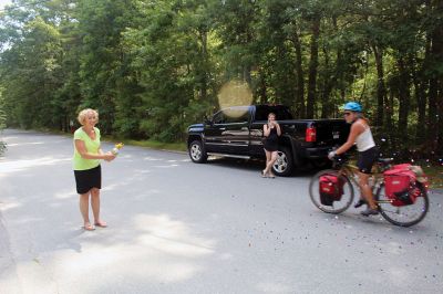 Homecoming Queens 
Colleen Oakes, originally from Marion, and Renee Buteyne, from Rochester, finished the trip of a lifetime on Monday, July 16, having ridden across the United States on their bicycles. Leaving Portland, Oregon on May 2, the two childhood friends arrived at Buteyne’s parents’ driveway about a month earlier than anticipated, greeted by family, friends, confetti, cookies, and of course, hugs. Photos by Jean Perry
