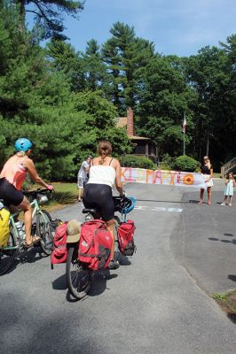 Homecoming Queens 
Colleen Oakes, originally from Marion, and Renee Buteyne, from Rochester, finished the trip of a lifetime on Monday, July 16, having ridden across the United States on their bicycles. Leaving Portland, Oregon on May 2, the two childhood friends arrived at Buteyne’s parents’ driveway about a month earlier than anticipated, greeted by family, friends, confetti, cookies, and of course, hugs. Photos by Jean Perry
