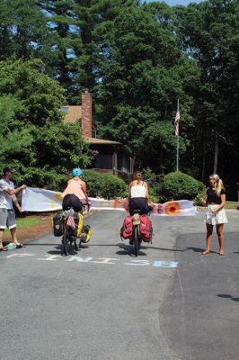 Homecoming Queens 
Colleen Oakes, originally from Marion, and Renee Buteyne, from Rochester, finished the trip of a lifetime on Monday, July 16, having ridden across the United States on their bicycles. Leaving Portland, Oregon on May 2, the two childhood friends arrived at Buteyne’s parents’ driveway about a month earlier than anticipated, greeted by family, friends, confetti, cookies, and of course, hugs. Photos by Jean Perry
