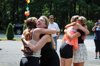 Homecoming Queens 
Colleen Oakes, originally from Marion, and Renee Buteyne, from Rochester, finished the trip of a lifetime on Monday, July 16, having ridden across the United States on their bicycles. Leaving Portland, Oregon on May 2, the two childhood friends arrived at Buteyne’s parents’ driveway about a month earlier than anticipated, greeted by family, friends, confetti, cookies, and of course, hugs. Photos by Jean Perry
