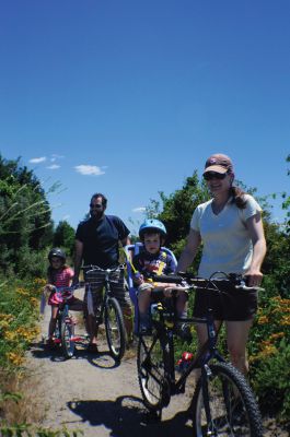 Bikeway Challenge
On Sunday, June 24, the Friends of the Mattapoisett Bike Path hosted their first annual South Coast Bikeway Challenge.  Local residents were invited to ride their bikes along the path in order to raise money for the completion of the ongoing project. In addition to the ride, live music was provided and the Mattapoisett Lions Club served lunch.  Pictured here from left to right; Chloe, Michael, Malcolm and Aimee Bean Enjoying Mattapoisett’s scenic bike path. Photo by Felix Perez.

