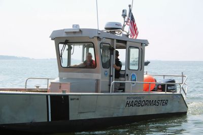 Blessing of the Fleet
The Reverend Eric Fialho, rector at Saint Gabriel’s Parish, presided as the Town of Marion held its first-ever Blessing of the Fleet on January 1 in Sippican Harbor. One tradition well established the past half-dozen years was the sunflower in the outer harbor, where several vessels tied up to one another at the stern and aimed their bows outward toward the sea in 360-degree formation. Photos by Mick Colageo
