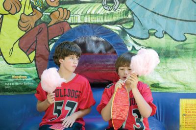 Block Party!
It was a little earlier than usual, but the annual Marion Block Party on August 28, 2010 went off without a hitch. Children enjoyed cotton candy, a bounce house and face-painting, while the grown-ups enjoyed conversation and good weather. It was an appropriate send-off to summer, before Old Rochester schools started back up on September 1. Photo by Felix Perez.
