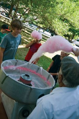 Block Party!
It was a little earlier than usual, but the annual Marion Block Party on August 28, 2010 went off without a hitch. Children enjoyed cotton candy, a bounce house and face-painting, while the grown-ups enjoyed conversation and good weather. It was an appropriate send-off to summer, before Old Rochester schools started back up on September 1. Photo by Felix Perez.
