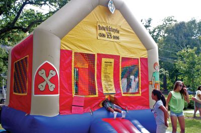 Marion Block Party
A child slips into a bounce house at the Marion Block Party on Saturday, August 25, 2012, at the Town Hall.  Photo by Eric Tripoli.

