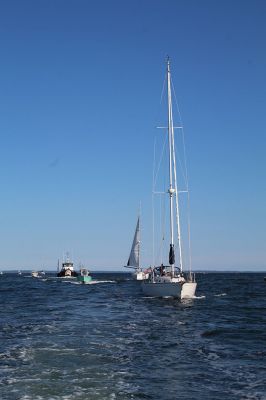 A procession estimated in excess of 100 vessels is seen from the stern of Mattapoisett’s 28-foot Harbormaster patrol boat late Sunday afternoon in Mattapoisett Harbor. The boats assembled and were led around the perimeter of the harbor, passing close by the Mattapoisett Boatyard and signaling with loud horns in a show of support. The boatyard was destroyed by a six-alarm fire on August 19. Photo by Mick Colageo
