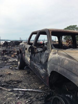 Mattapoisett Boatyard Fire
One of the 47 vehicles destroyed by the August 19 fire at the Mattapoisett Boatyard. First responders from 19 communities, state agencies and the U.S. Coast Guard responded to the six-alarm blaze. In the August 22 press release, Mattapoisett Fire Chief Andrew Murray and State Fire Marshall Peter Ostroskey pointed to the ignition of gasoline vapors during the replacement of a boat’s gas tank as the likely origin and cause of the fire. Photo by Marilou Newell August 25, 2022 edition
