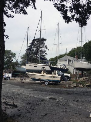 Mattapoisett Boatyard Fire
Smoke rose over Mattapoisett Harbor on August 19 after a boat caught fire during the replacement of a gasoline tank. An explosion followed by a raging fire leveled Mattapoisett Boatyard and destroyed the 14 boats and 47 vehicles on site. Members of the Kaiser family who own the business and members of the McLean family who founded the business surveyed the ruins on the weekend and vow to rebuild. Photos by Marilou Newell and courtesy of Mattapoisett Police and Fire departments and Kathleen Costello
