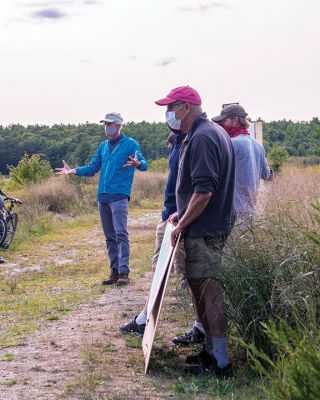 Mattapoisett Bogs
Brendan Annett, the Buzzards Bay Coalition’s vice president for Watershed Protection, speaks on Tuesday to a crowd of attendees about work being done at the Mattapoisett Bogs. The 57-acre property off of Acushnet Road was retired as cranberry bogs in 2012, and Buzzards Bay Coalition is working in partnership with Mattapoisett and federal and state agencies to transform the land back to its primitive state prior to industrialization. See story. Photo by Ryan Feeney
