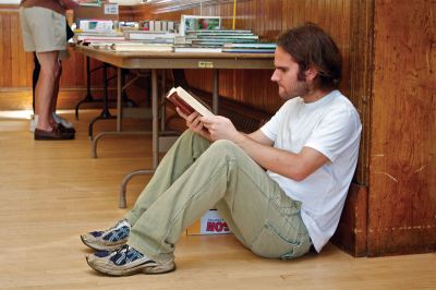 Taber Library Book Sale
Benjamin Susman of Laurel, Md. thumbs through a book on the Vanderbilt family.  Susman, whose grandfather lives on Front Street in Marion, had never before attended the Taber Library used book sale.  Photo by Eric Tripoli.
