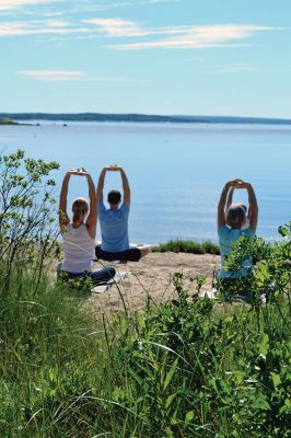 Brainard Marsh Yoga
About a dozen people enjoyed some gentle yoga by the calm, reflective waters off Brainard Marsh in Marion the early morning of June 21. The Sippican Lands Trust Summer Yoga Series is underway, with adult yoga on select Saturdays at 9:00 am and kids yoga at 10:00. The two other dates scheduled are July 5 and August 16. Photo by Jean Perry
