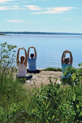 Brainard Marsh Yoga
About a dozen people enjoyed some gentle yoga by the calm, reflective waters off Brainard Marsh in Marion the early morning of June 21. The Sippican Lands Trust Summer Yoga Series is underway, with adult yoga on select Saturdays at 9:00 am and kids yoga at 10:00. The two other dates scheduled are July 5 and August 16. Photo by Jean Perry
