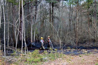 Brush Fire
A five-acre brushfire broke out on the Mattapoisett/Rochester town line on Saturday afternoon in the woods near Wolf Island Road and Long Plain Road. Photo by Eric Trippoli
