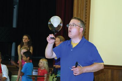 Bubbles, bubbles, everywhere! 
Kids were spellbound by Keith Johnson and his “Bubbleology” show at the Marion Music Hall on June 22, sponsored by the Elizabeth Taber Library. Ty Mackenzie, 9, was the lucky one who got to be swallowed up by a giant bubble. Photos by Jean Perry
