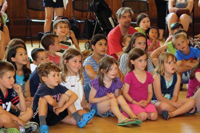 Bubbles, bubbles, everywhere! 
Kids were spellbound by Keith Johnson and his “Bubbleology” show at the Marion Music Hall on June 22, sponsored by the Elizabeth Taber Library. Ty Mackenzie, 9, was the lucky one who got to be swallowed up by a giant bubble. Photos by Jean Perry
