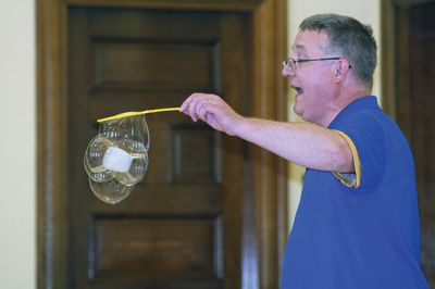 Bubbles, bubbles, everywhere! 
Kids were spellbound by Keith Johnson and his “Bubbleology” show at the Marion Music Hall on June 22, sponsored by the Elizabeth Taber Library. Ty Mackenzie, 9, was the lucky one who got to be swallowed up by a giant bubble. Photos by Jean Perry
