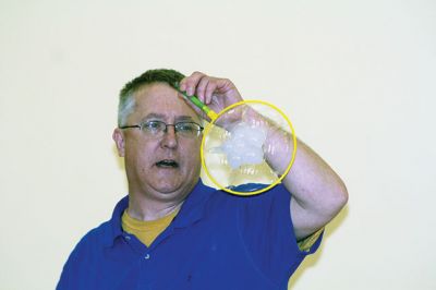 Bubbles, bubbles, everywhere! 
Kids were spellbound by Keith Johnson and his “Bubbleology” show at the Marion Music Hall on June 22, sponsored by the Elizabeth Taber Library. Ty Mackenzie, 9, was the lucky one who got to be swallowed up by a giant bubble. Photos by Jean Perry
