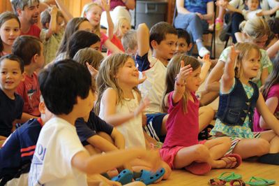 Bubbles, bubbles, everywhere! 
Kids were spellbound by Keith Johnson and his “Bubbleology” show at the Marion Music Hall on June 22, sponsored by the Elizabeth Taber Library. Ty Mackenzie, 9, was the lucky one who got to be swallowed up by a giant bubble. Photos by Jean Perry
