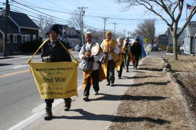 Buddha Trek
While most of us bunkered down in our offices and homes on this clear winter day, about a dozen members of the Nipponzan Myohoji, a Japanese Buddhist Order, and their supporters could be seen walking, chanting and banging a drum along Route 6 on February 24, 2011. Photo by Laura Pedulli
