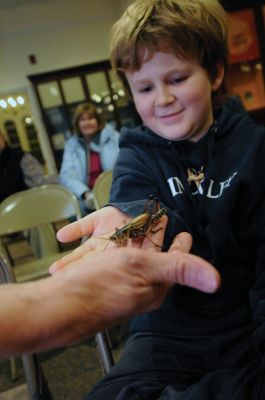 Bugworks
The Marion Natural History Museum provided an opportunity on February 27 to get up close and personal with critters from the insect world, including praying mantises and jumbo-sized grasshoppers. Above: Tapper Crete, 7, was the first one brave enough to ask to touch a praying mantis. The event was hosted by Maire Anne Diamond, owner and educator at ‘Bugworks.’ Photos by Felix Perez
