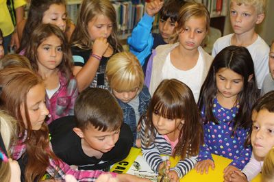 Monarch Moment
Ella Gillen, 10, and Sofia Gillen, 8, watched a chrysalis that originated from their backyard hatch on Tuesday at the Mattapoisett Library. It was serendipity that the two girls were there with their mother, Tracy, to catch the chrysalis beginning to break open to release a fully developed Monarch butterfly into the world. Photos by Jean Perry
