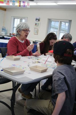 Create & Connectivity
As part of Art Week, the Marion Art Center joined the Council on Aging on Saturday morning, May 4, for a seniors and children’s “Create & Connectivity” event at the Benjamin D. Cushing Community Center. Participants of all ages used colorful paper cuts and glue to decoupage small wooden trays. Photos by Jean Perry
