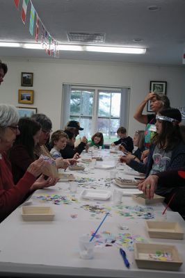 Create & Connectivity
As part of Art Week, the Marion Art Center joined the Council on Aging on Saturday morning, May 4, for a seniors and children’s “Create & Connectivity” event at the Benjamin D. Cushing Community Center. Participants of all ages used colorful paper cuts and glue to decoupage small wooden trays. Photos by Jean Perry
