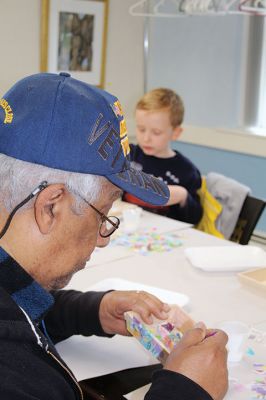 Create & Connectivity
As part of Art Week, the Marion Art Center joined the Council on Aging on Saturday morning, May 4, for a seniors and children’s “Create & Connectivity” event at the Benjamin D. Cushing Community Center. Participants of all ages used colorful paper cuts and glue to decoupage small wooden trays. Photos by Jean Perry
