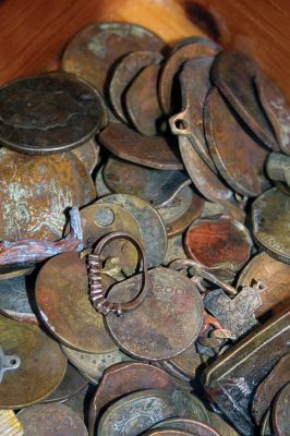 Lost Coins
They say one person’s trash is another’s treasure. Treasure or not, the workers at SEMASS, the massive trash to energy facility in Rochester, never know what might filter through while processing the region’s trash. This collection of metal objects is a sample of the myriad metal things pulled from the trash flow by large magnets every day. Looks like treasure to us! Photo by Jean Perry January 17, 2019 edition
