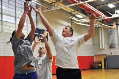 Shooting for Scholars
Andrea Rand, Craig Davignon, and Tony Cambra vie for a rebound during the Tri-Town Trotters practicePhoto by Rebecca McCullough. April 7, 2011 edition
