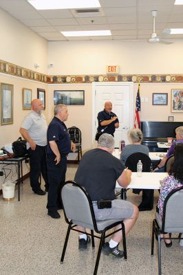 CPR Class
May Caron, 19, of Marion demonstrates a sound CPR form on a manikin, while New Bedford EMS trainer David Branco explains the practice during a September 21 class held at the Rochester Senior Center under the direction of the Rochester Fire Department. Branco and David Zander also demonstrated the use of a battery-operated, $15,000 CPR machine that last month was used during a cardiac event to save the life of Rochester Fire Chief Scott Weigel
