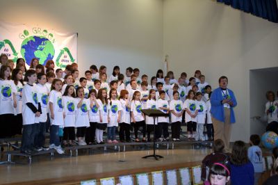 Earth Day
Center School Principal Rose Bowman speaks to the crowd at Center School's First Annual Earth Day Celebration with the 3rd Grade Chorus looking on. Photo by Adam Silva
